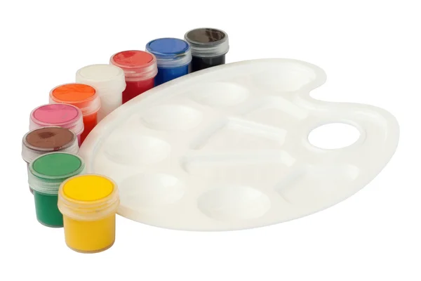 Пластиковая белая палитра с банками краски — стоковое фото