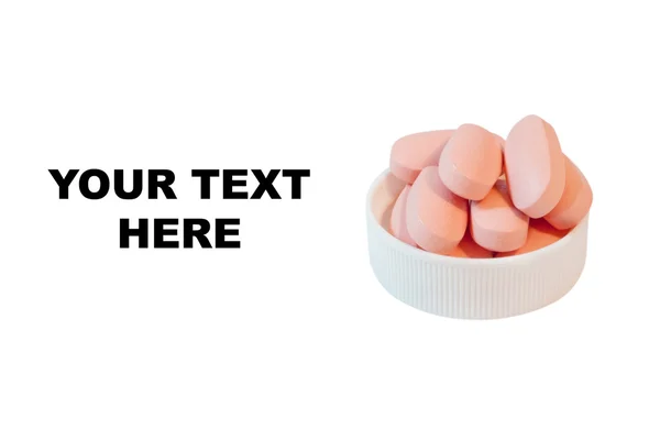 Pile of pink pills in the lid — Stock Photo, Image