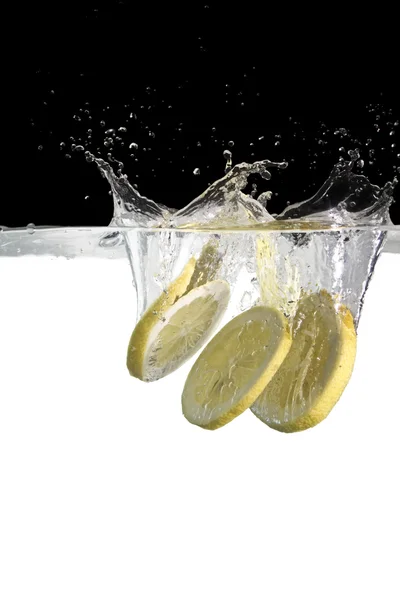 Lemon slices in water — Stock Photo, Image