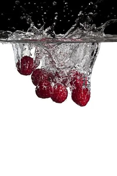 Raspeberries in water — Stock Photo, Image