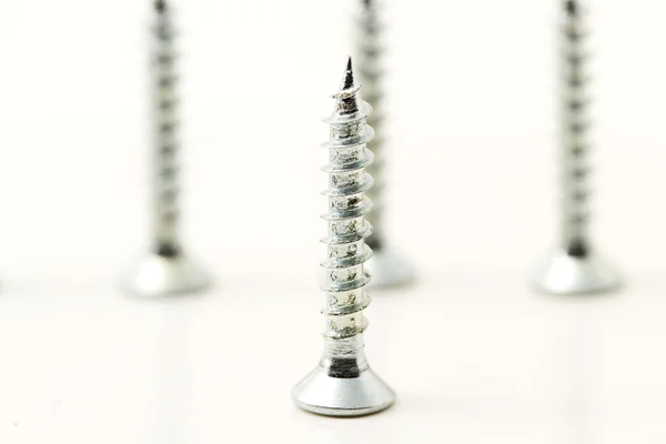 One screw in front of three — Stock Photo, Image