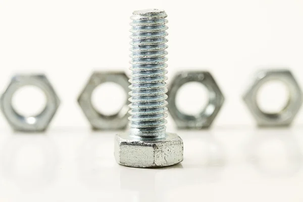 Screw in front of four — Stock Photo, Image