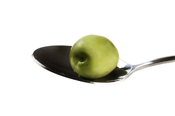 Green olive on a spoon — Stock Photo, Image