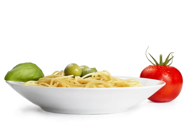 Plate with pasta tomato olives and basil — Stock Photo, Image