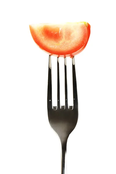 Tomato on a fork Royalty Free Stock Images
