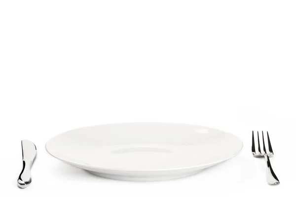 Тарелка со столовыми приборами — стоковое фото