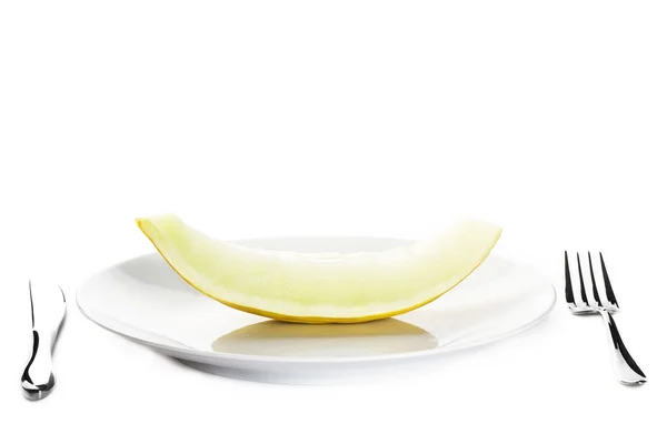 Honeydew melon on a plate — Stock Photo, Image