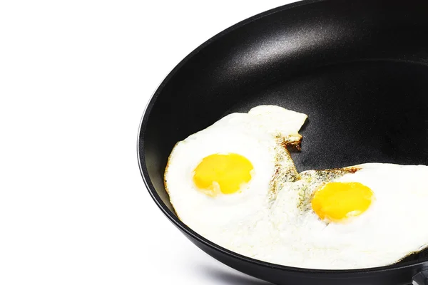 Fried eggs in a pan — Stock Photo, Image