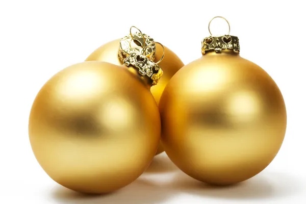 Três bolas de Natal maçantes douradas — Fotografia de Stock