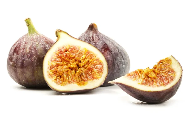 Two wet figs and a half and a wedge — Stock Photo, Image