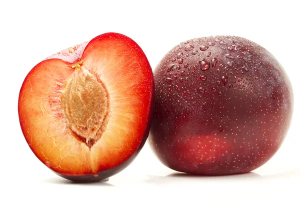 Wet plum and a half — Stock Photo, Image