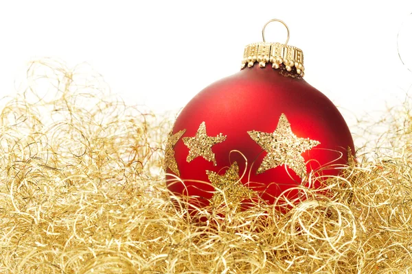 Red dull christmas ball in golden glitter cotton — Stok fotoğraf