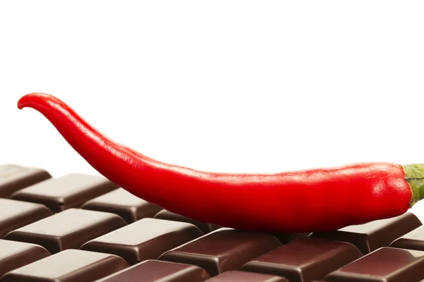 Red chili on a chocolate bar — Stock Photo, Image