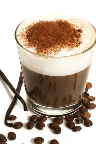 Coffee in a short glass with milk froth beans and vanilla — Stock Photo, Image