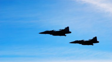 Two aircraft Jas 39 Gripen on blue sky clipart