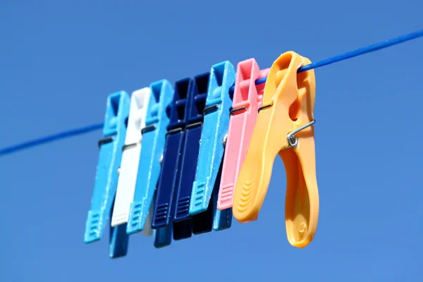 Cloth pegs with a under the blue sky — Stock Photo, Image