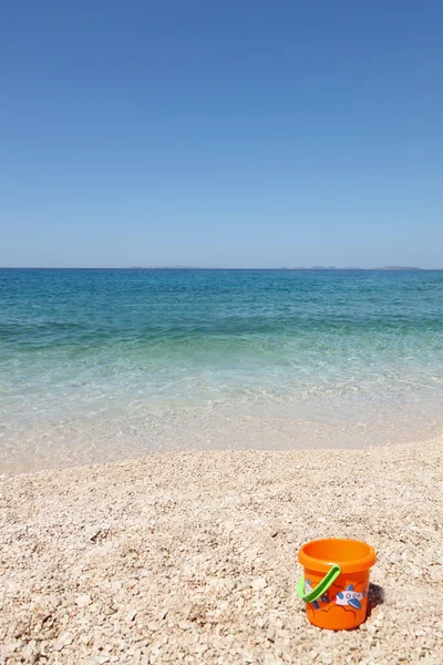 stock image Beautiful beach with child's bucket