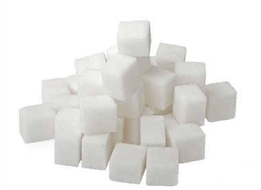 Lump sugar pile isolated on white. clipart