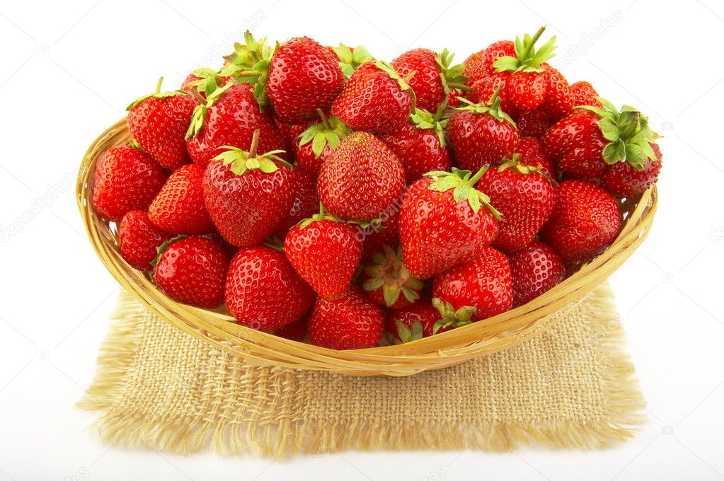 Strawberries in a basket isolated on white. XXL!