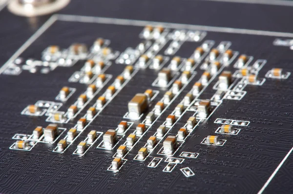 Closeup of electronic circuit board with transistors — Stock Photo, Image