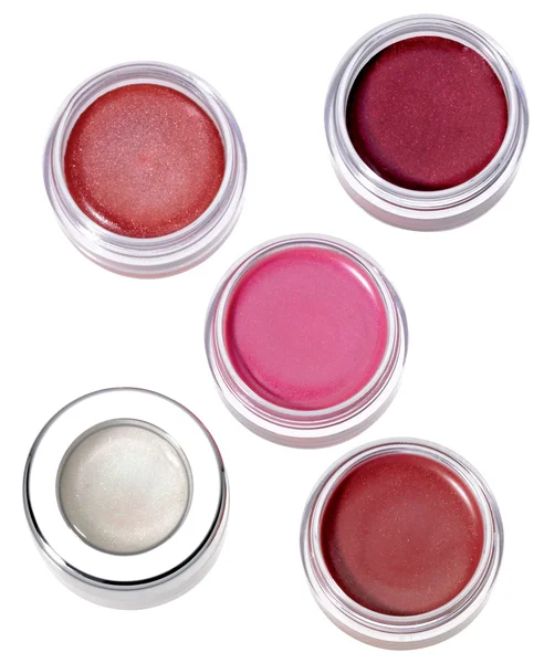 Multy-colored lip gloss in round silver plastic containers on wh — Stock Photo, Image