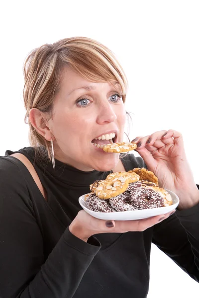 Pretty blond girl with cookies — Stock Photo, Image