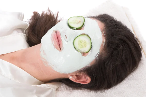 Woman taking a claymask — Stock Photo, Image