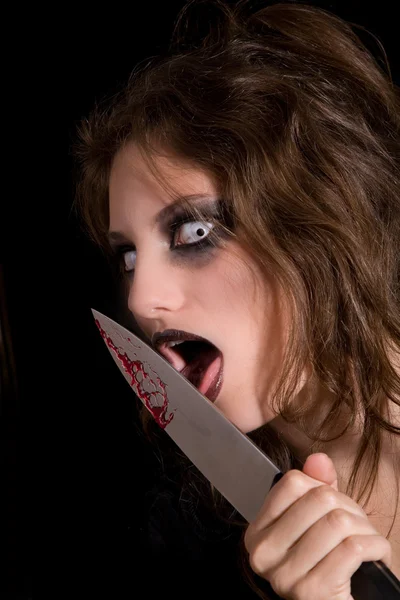 Licking the knife — Stock Photo, Image