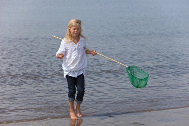 Young girl with fishing net clipart