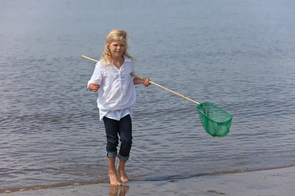 Młoda dziewczyna z sieci rybackie — Zdjęcie stockowe