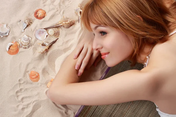Girl on beach carpet — Stock Photo, Image