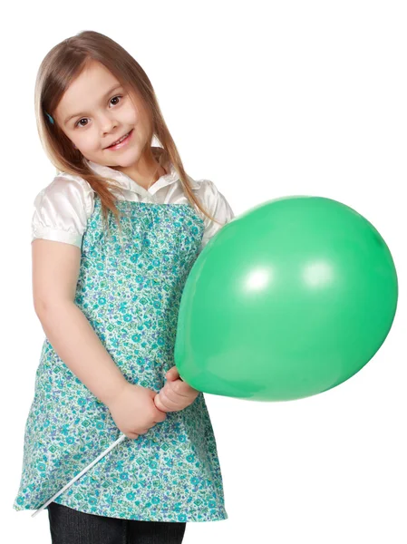 Κοπέλα που κρατά ένα πράσινο μπαλόνι — Φωτογραφία Αρχείου
