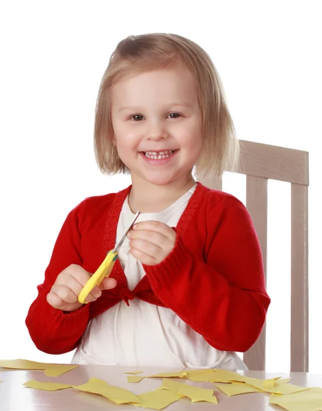 Девушка играет с циссором — стоковое фото