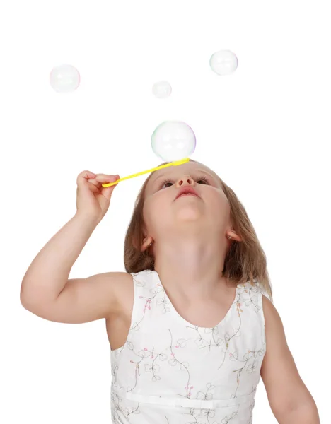 Милая маленькая девочка и пузырьки — стоковое фото