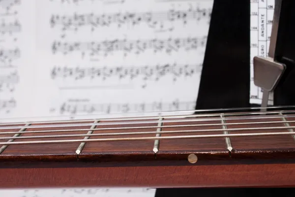 Closeup Guitar Neck, Notes, Metronome — Stock Photo, Image