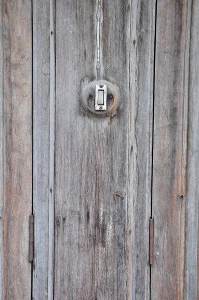 Zumbador en pared de madera — Foto de Stock