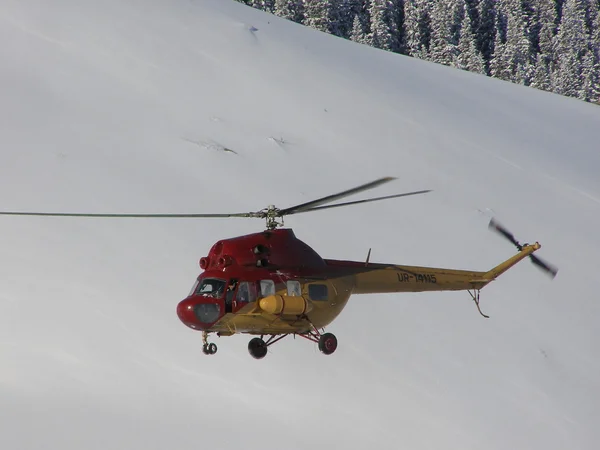 Stock image The helicopter against a slope