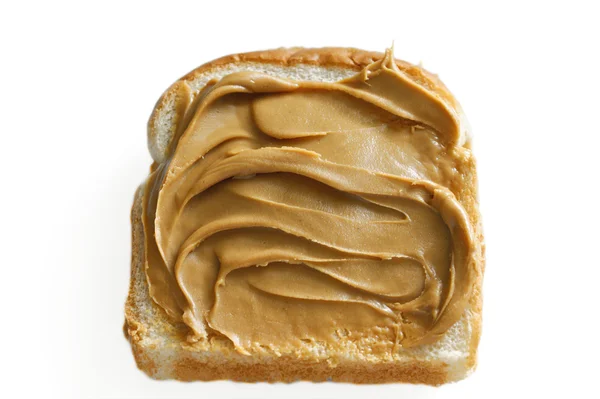 Stock image Peanut butter on white bread