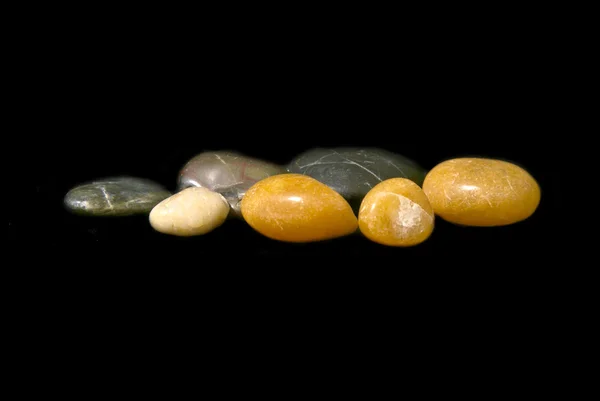 stock image Polished stones floaring on black