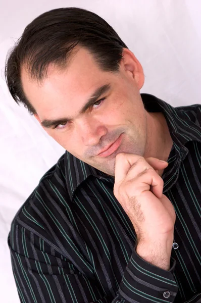 Professional man with hand on chin — Stock Photo, Image