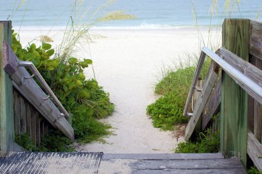 Wooden steps leading to beach clipart