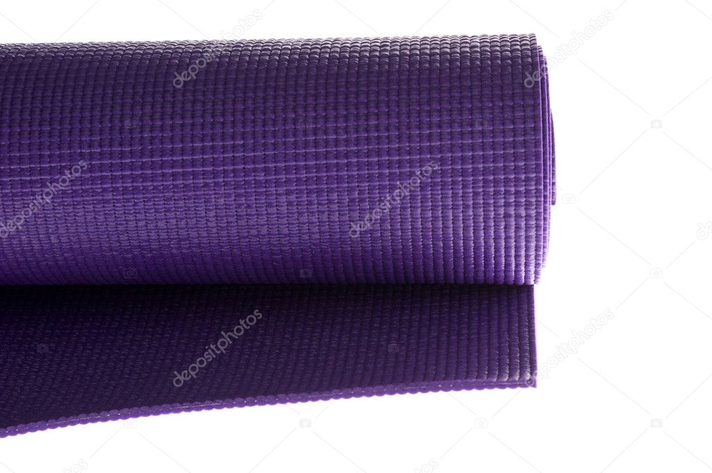 Purple yoga mat on white