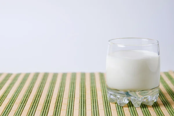 stock image Glass of milk on a table