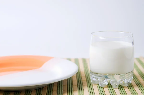 stock image Glass of milk and plate