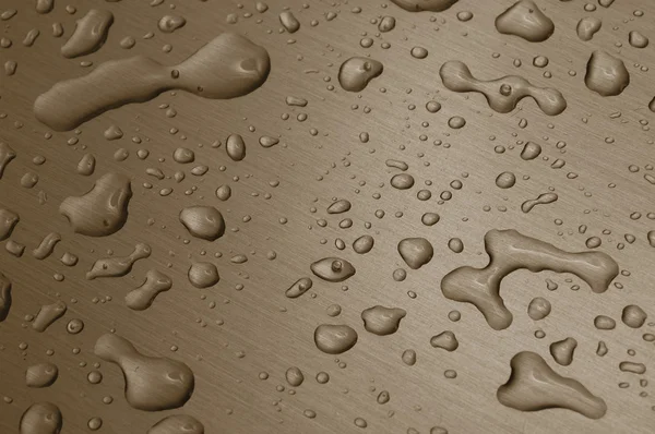 Gocce d'acqua sulla superficie metallica — Foto Stock