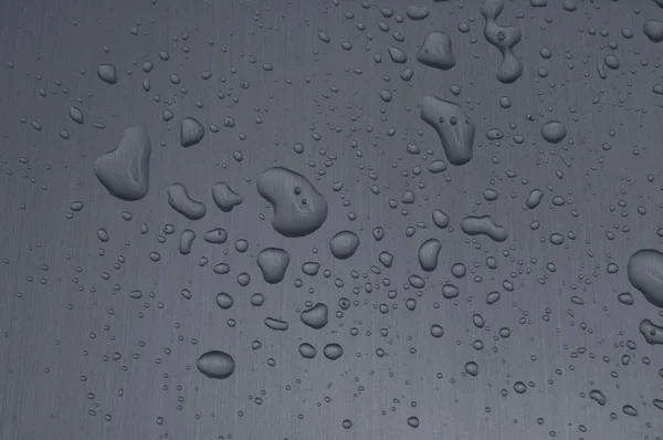 Gotas de agua en superficie metálica — Foto de Stock