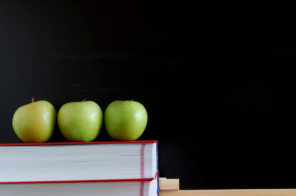 Blank blackboard with apples Royalty Free Stock Images