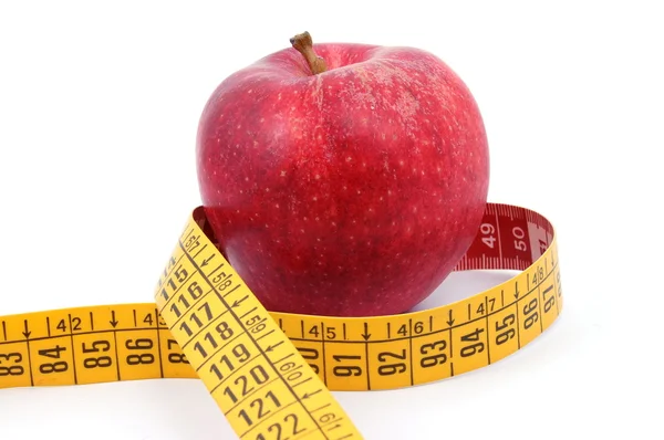 Apple and measuring tape on white — Stock Photo, Image