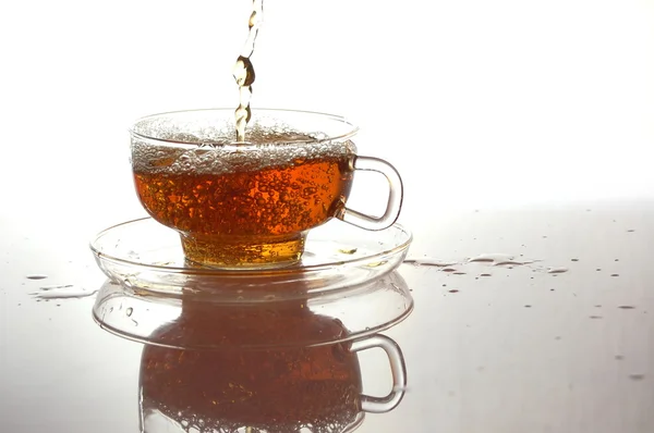 Cup of tea on white with reflection — Stock Photo, Image
