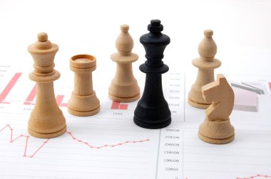 Chess man over business chart clipart